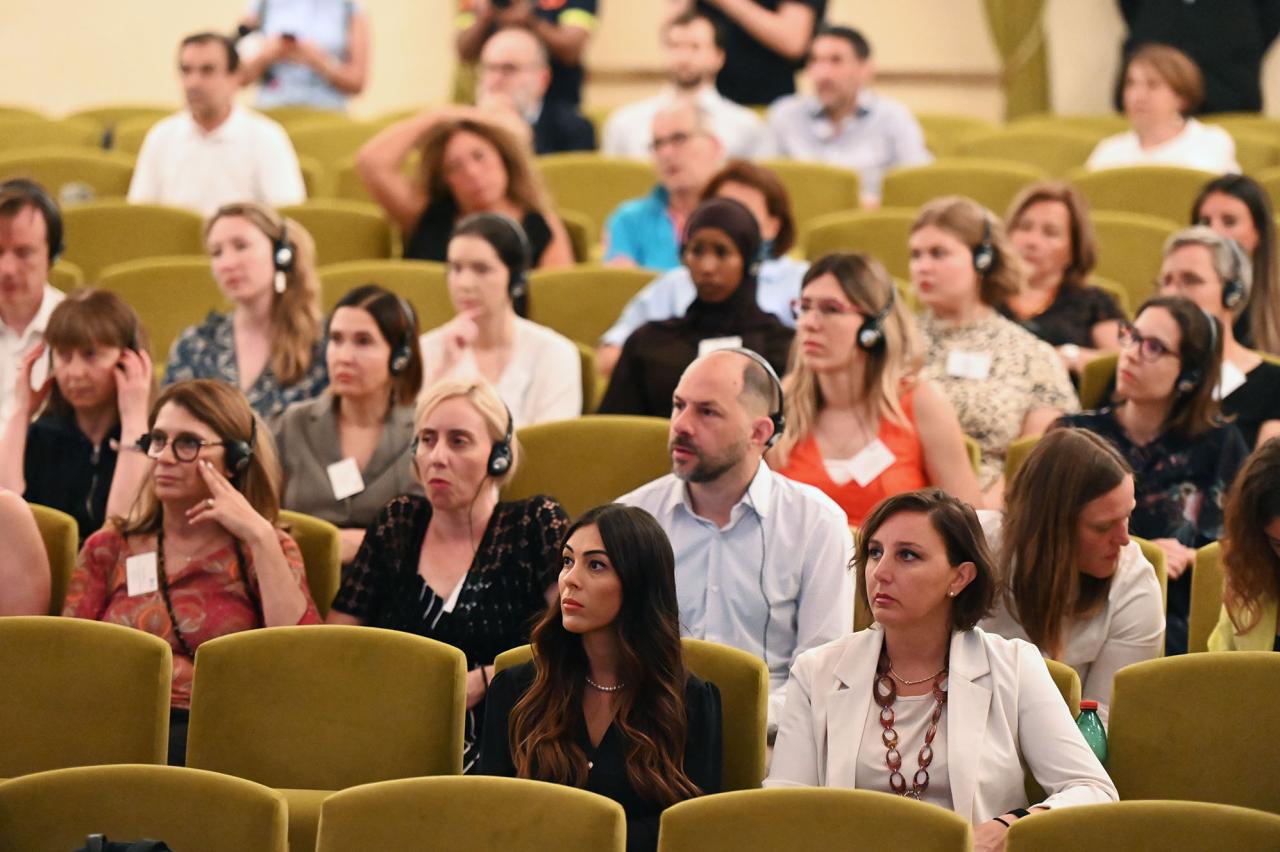 Attentive audience listening to presenters